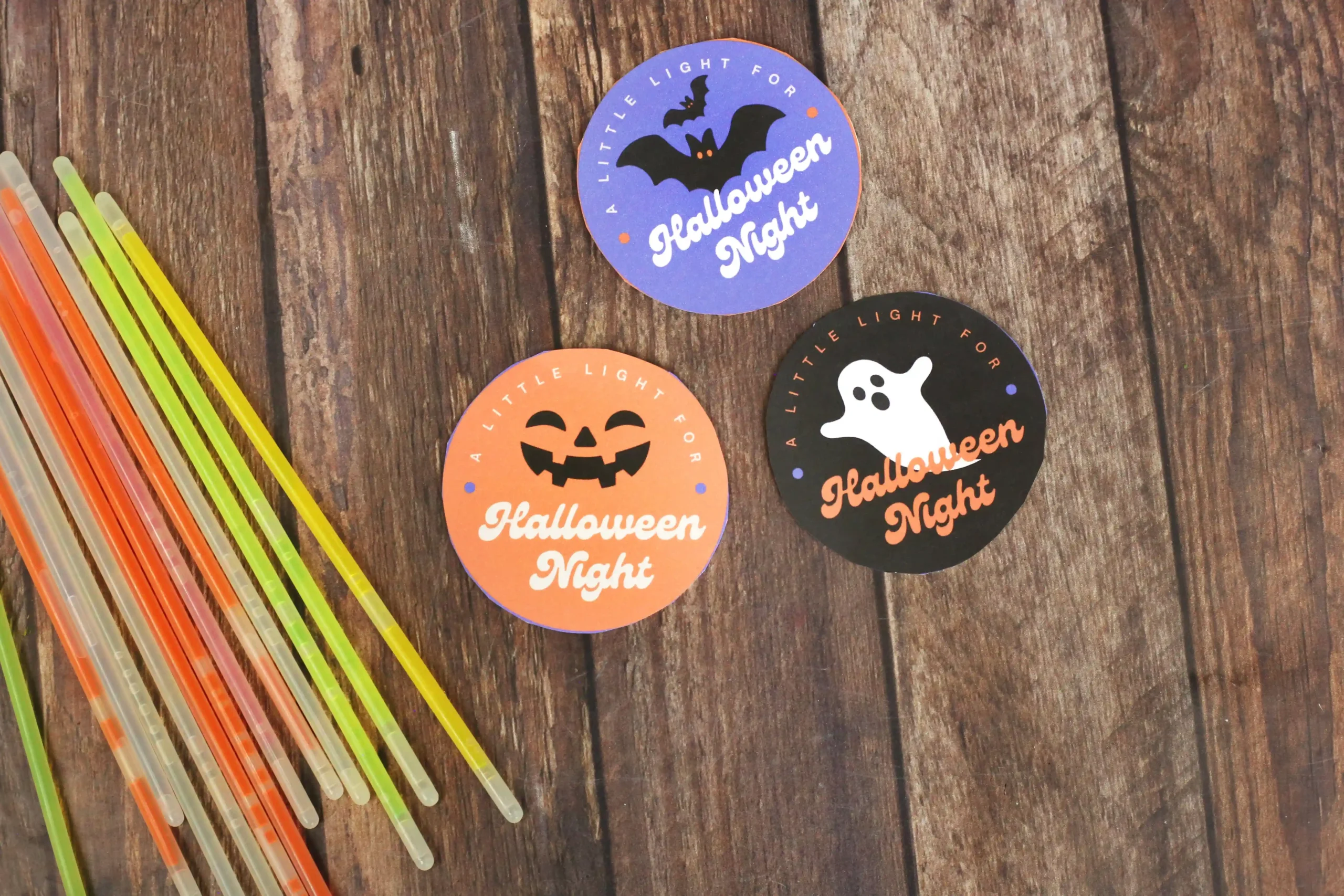 circular tags that read "a light for halloween night"