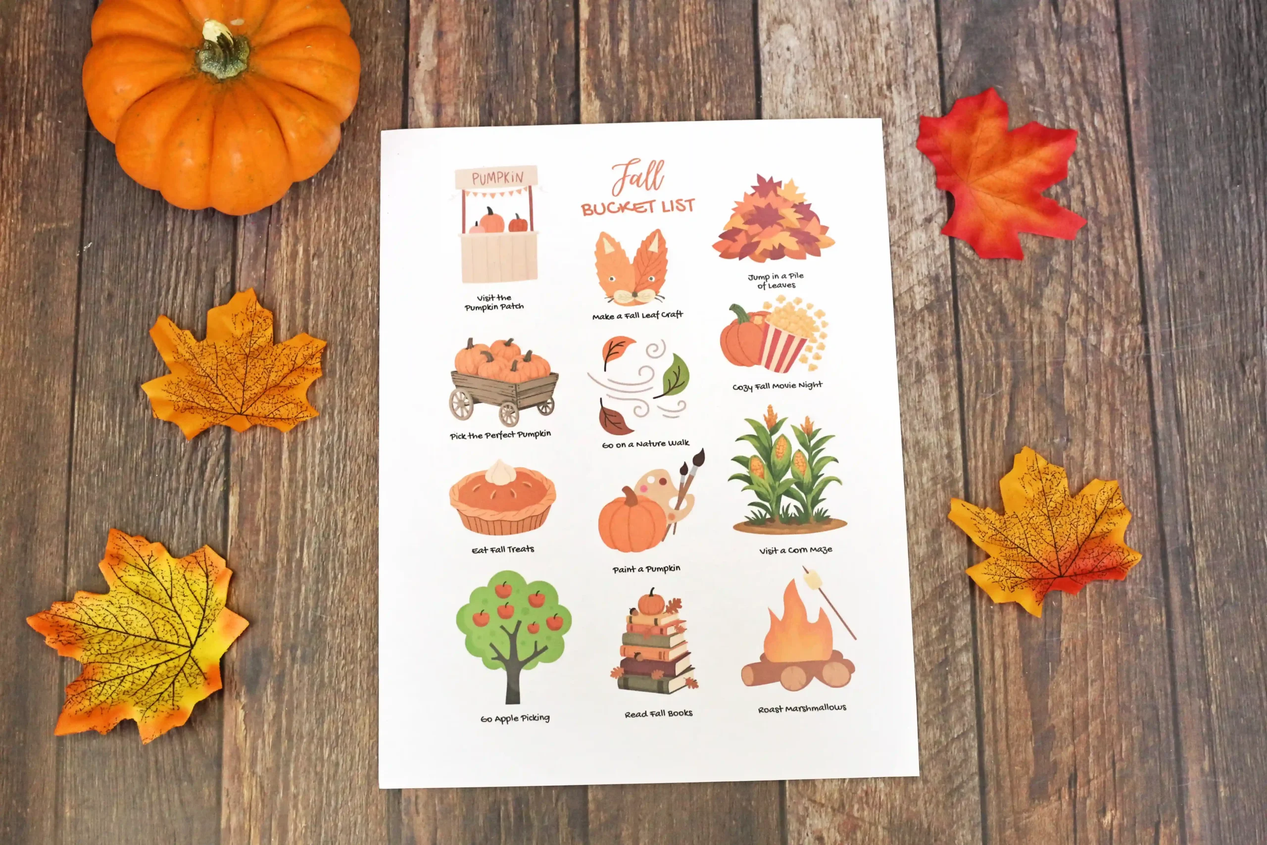 a fall bucket list printable on a wooden background