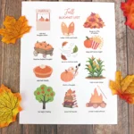 a fall bucket list printable on a wooden background