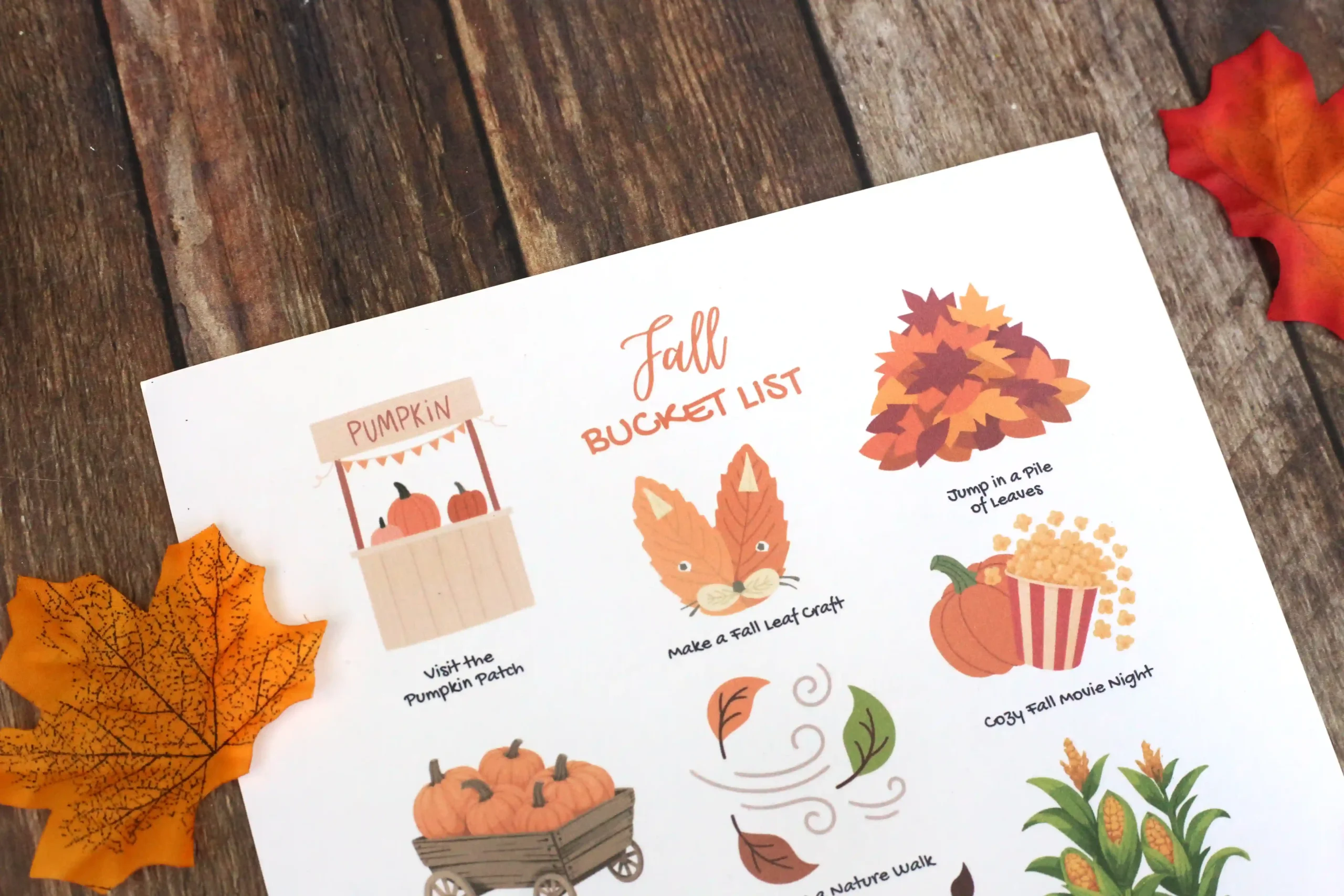 a fall bucket list printable on a wooden background
