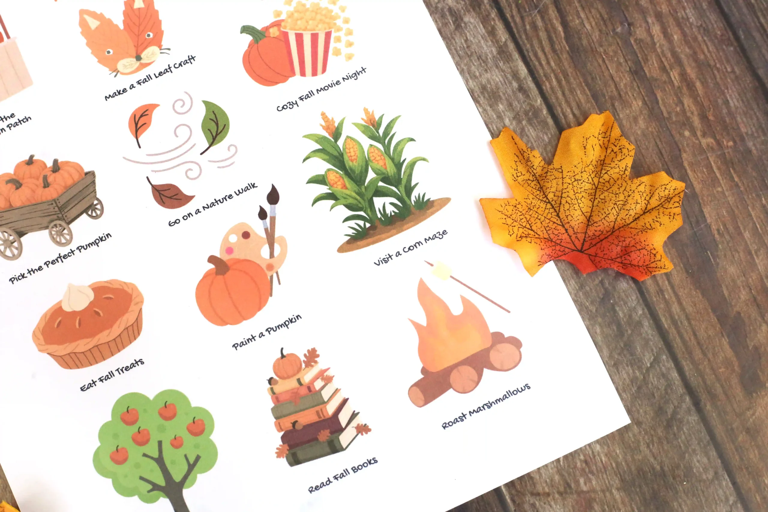 a fall bucket list printable on a wooden background