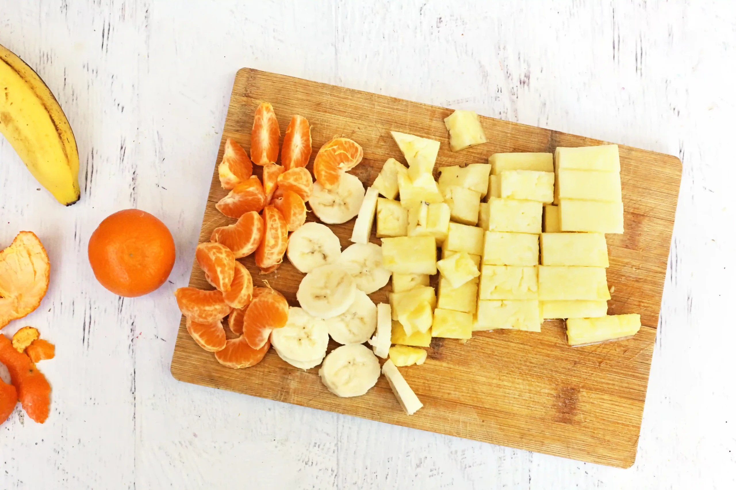 cut up fruit on a cutting board