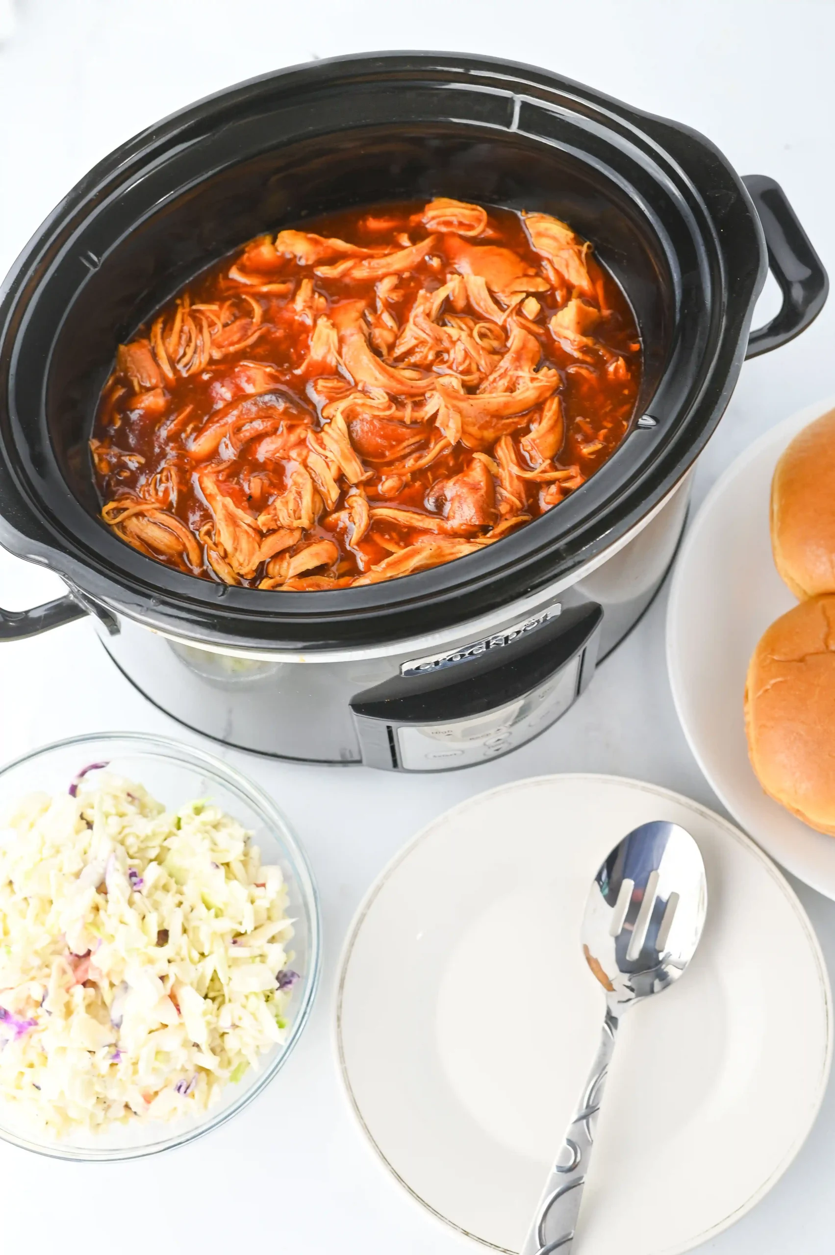 a crockpot with barbecue chicken inside