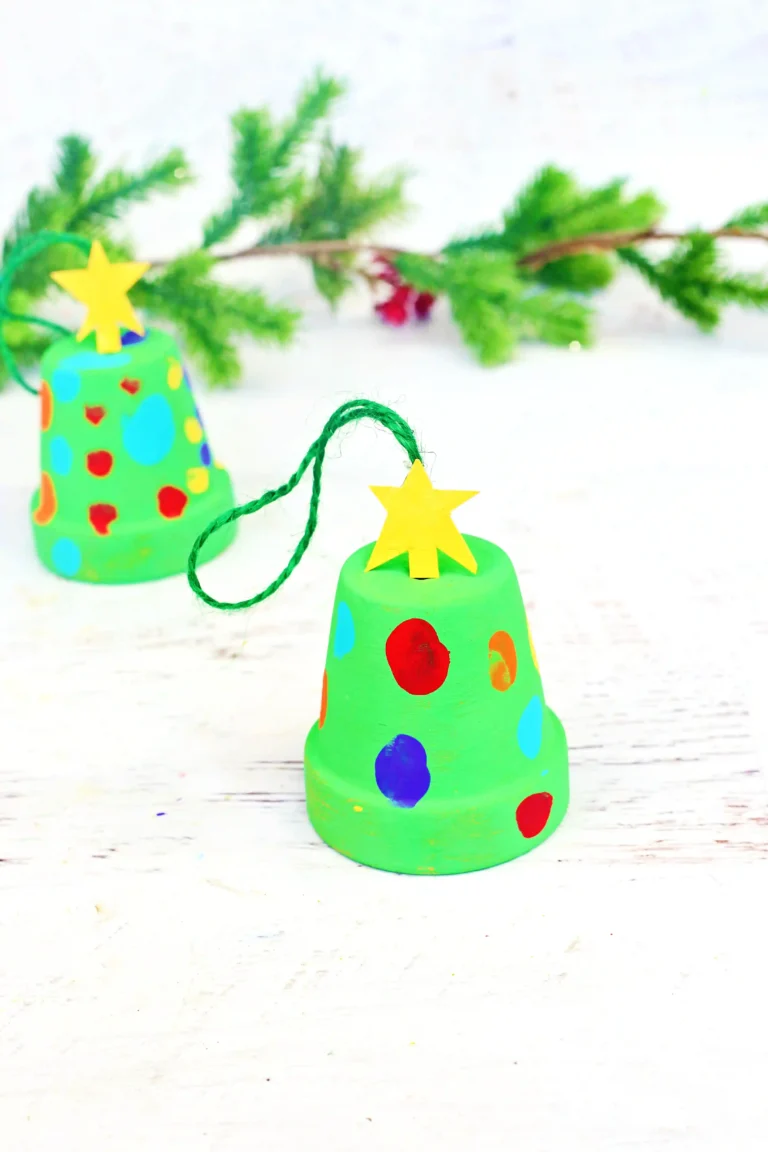 a clay pot painted green with fingerprint "lights"