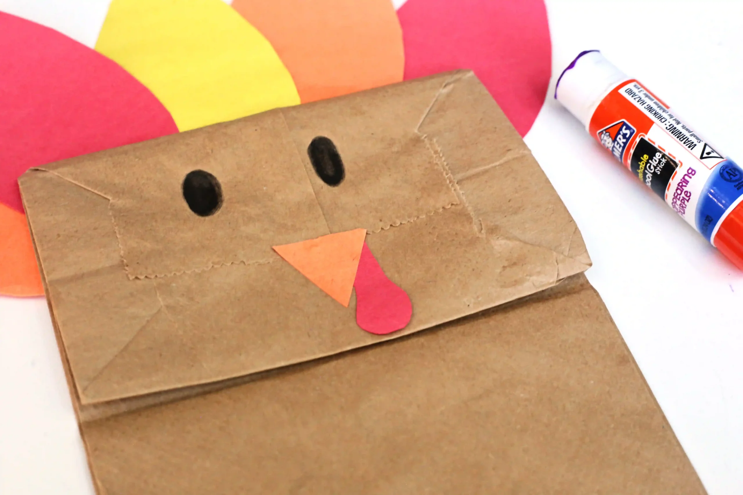 a paper bag decorated to look like a turkey