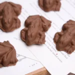 chocolate frogs on pages of a book