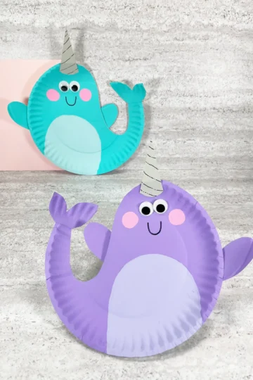 paper plates painted and decorated to look like narwhals