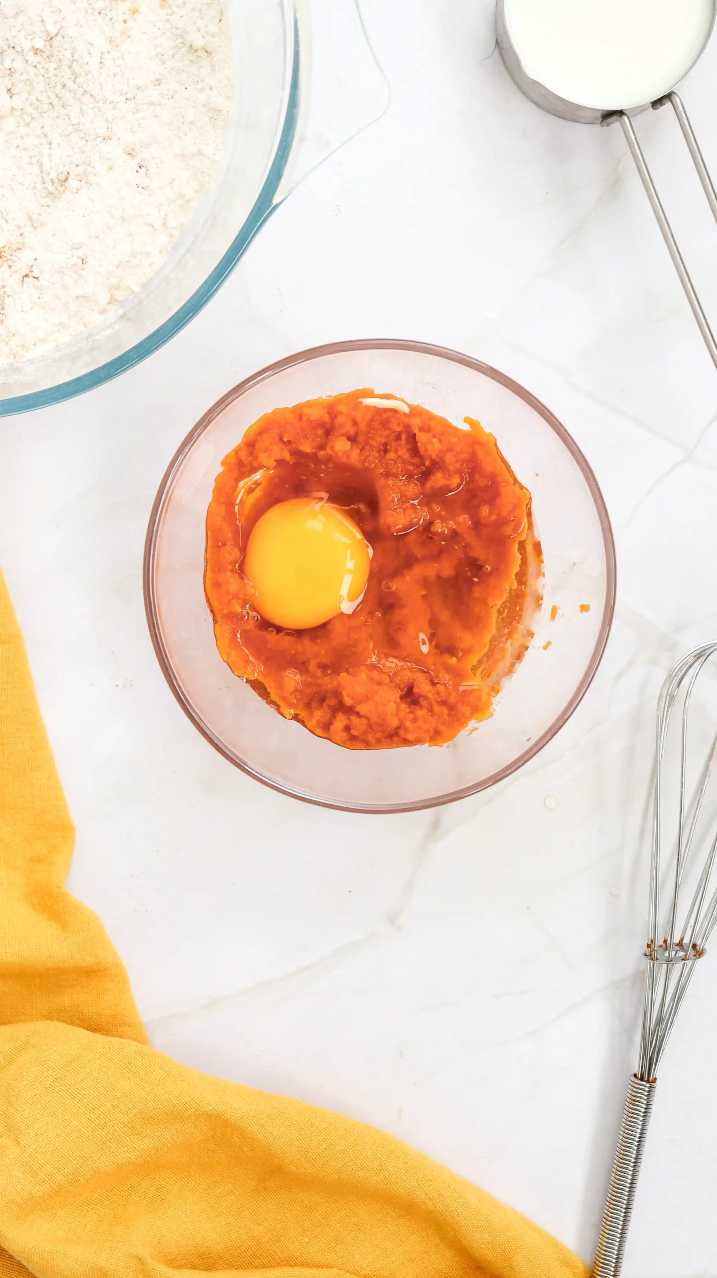 pumpkin puree, milk, egg, and melted butter in a bowl