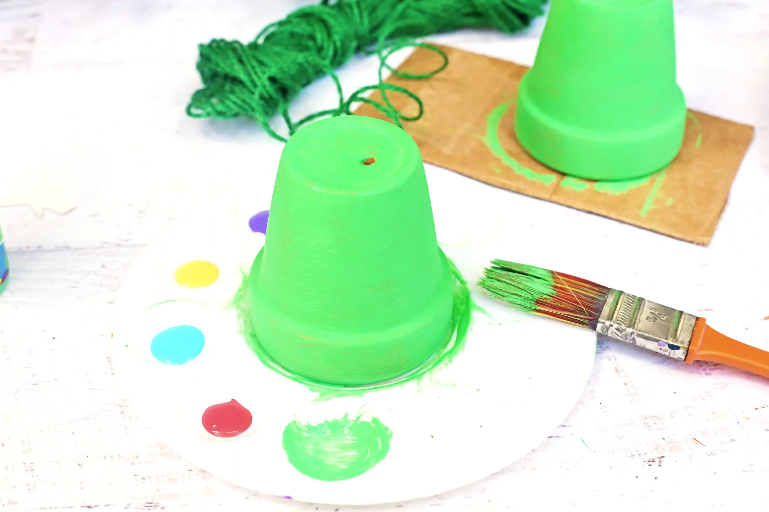 a clay pot painted green