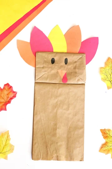 a paper bag decorated to look like a turkey