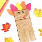 a paper bag decorated to look like a turkey