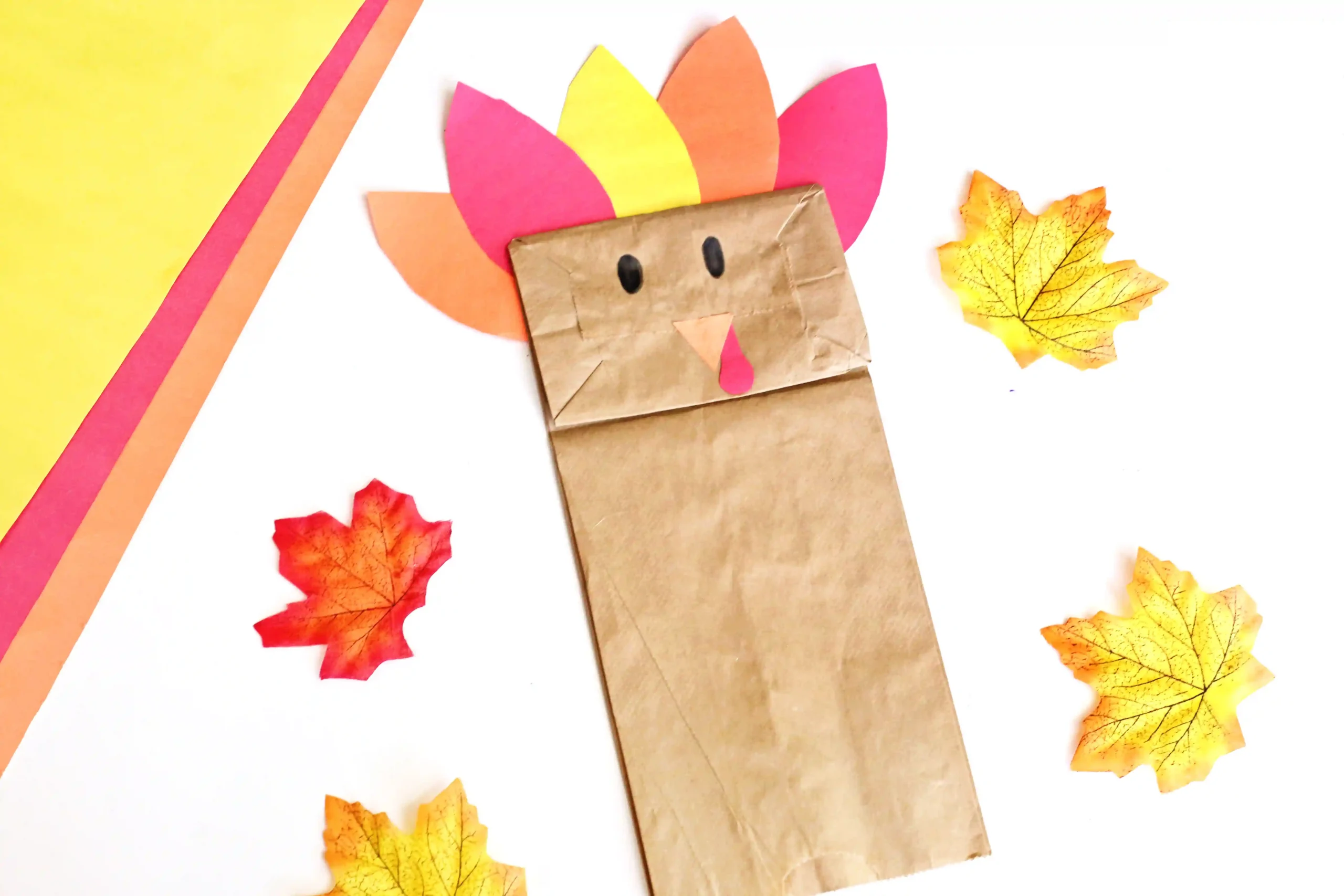 a paper bag decorated to look like a turkey