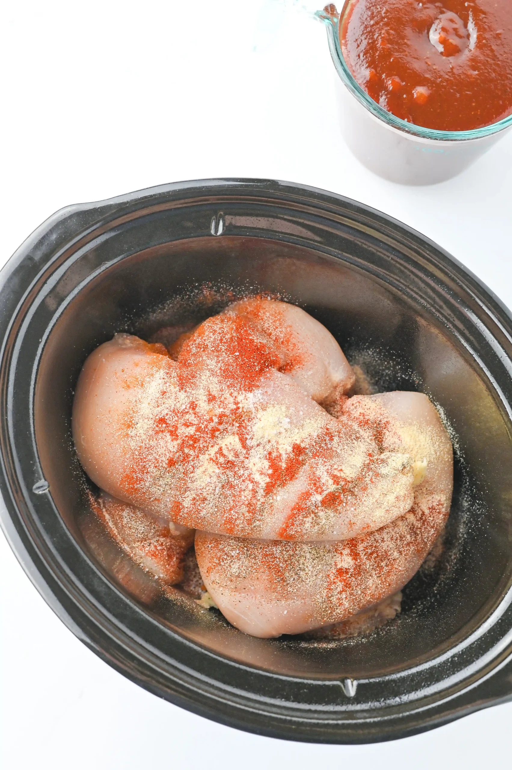 chicken breasts with spices in a crockpot