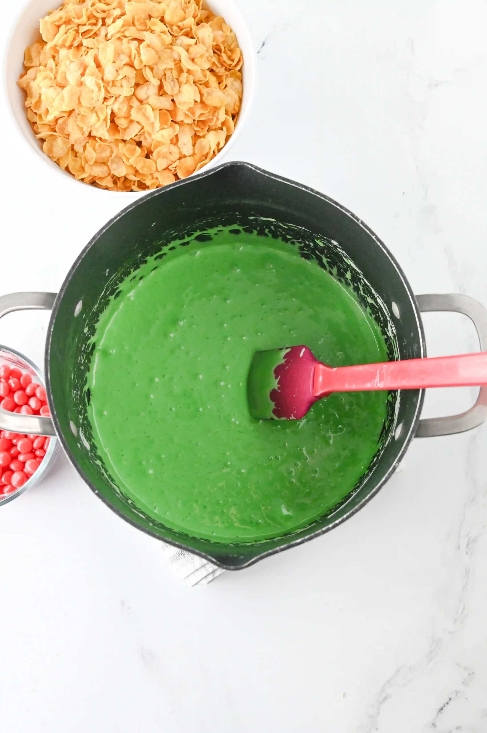 butter, marshmallows, and green dye in a pot